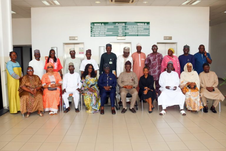 Members of FCDA's Executive Management Committee ( EMC); the retiree; his wife; and daughter.
