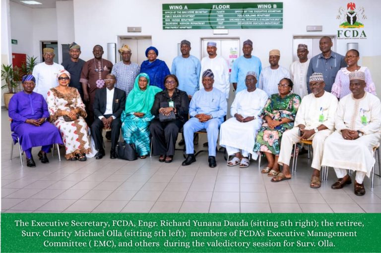 Group photograph of Surveyor Charity Michael Olla's retirement