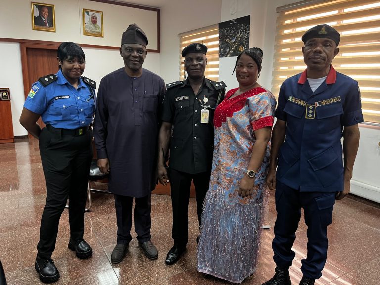 The Executive Secretary, FCDA, Engr. Richard Yunana Dauda (2nd left); Chief Security Officer, FCDA, ASP Goodness Ebi( first left); ASP Eyong Ubi; his wife, Mrs Joy Ubi Eyong, and Superintendent of Corps, Nigeria Security and Civil Defence Corps (NSCDC), Ibanga Emmanuel during Ubi's decoration.