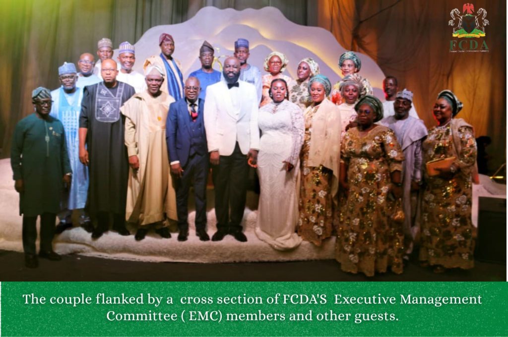 The couple flanked by a cross-section of FCDA's Executive Management Committee (EMC) members and other agents